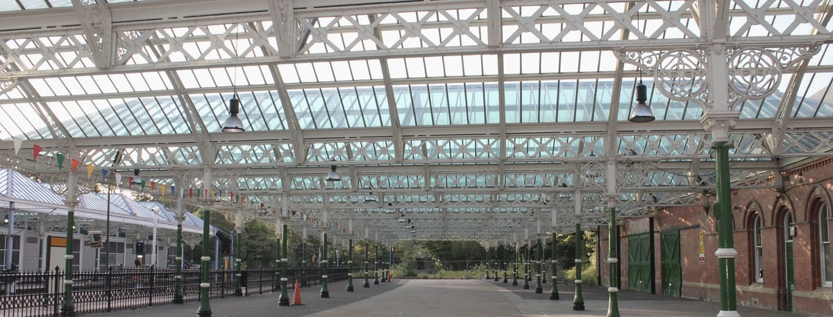 The empty platform beneath the Victorian glass and ironwork canopy of Tynemouth Metro station